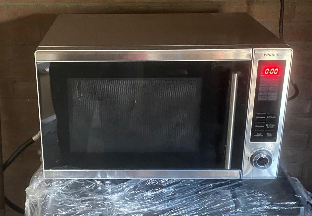 RVS combimagnetron met grill en hete lucht (ovenfunctie), Witgoed en Apparatuur, Ophalen, Combimagnetron, Gebruikt, Hete lucht