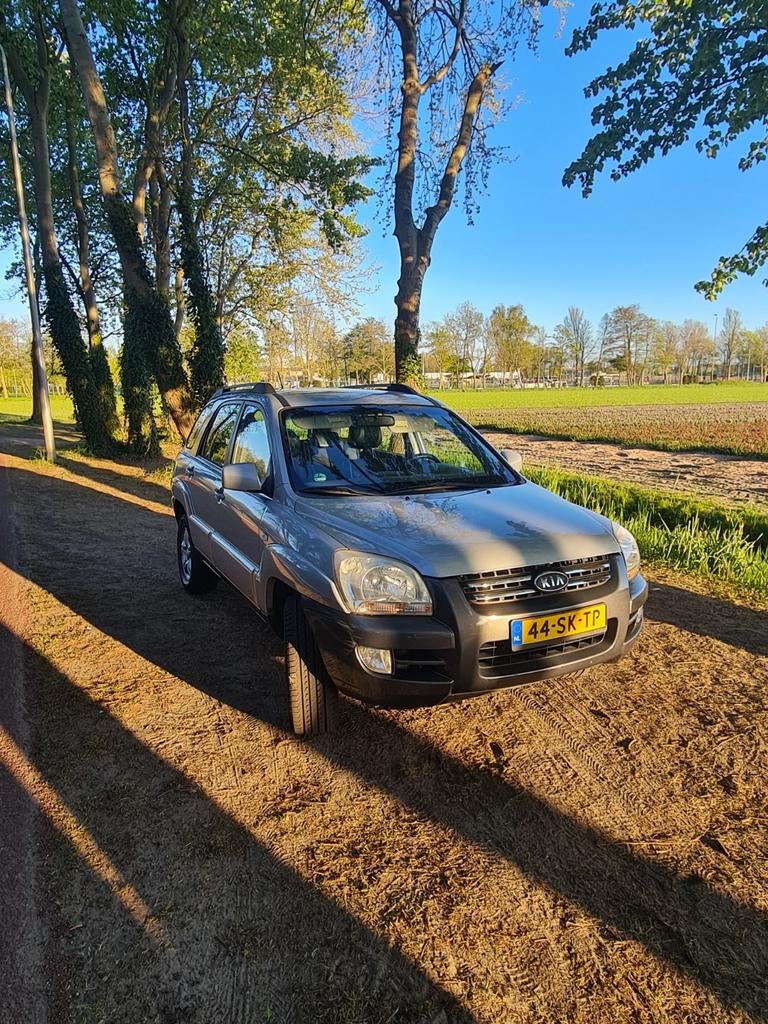 Kia Sportage 2.0 2WD 2006 Grijs, Auto's, Kia, 1442 kg, Zwart, 4 cilinders, Leder en Stof
