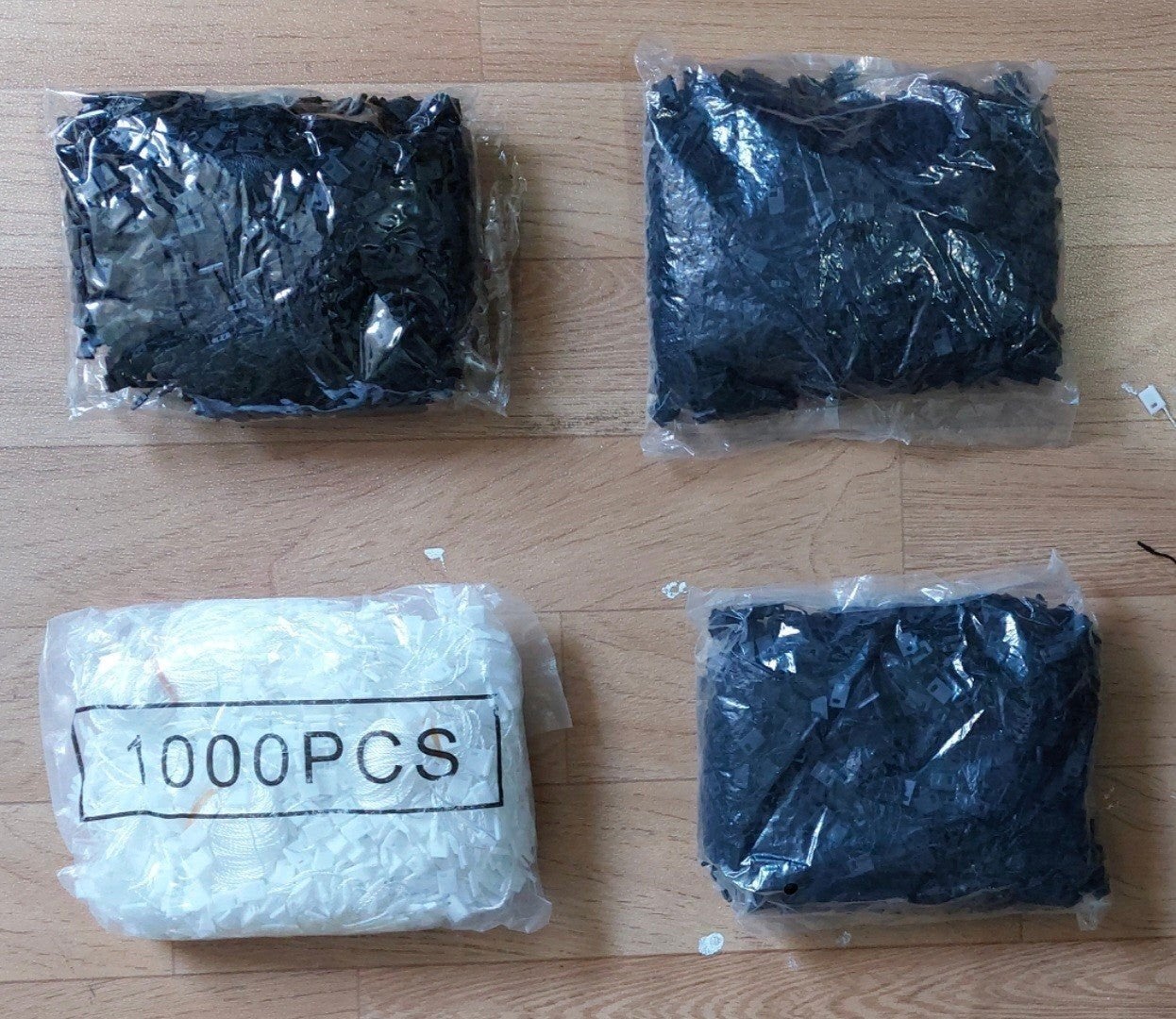 4.000 stuks witte/zwarte hangtag koordjes met kliksluiting, Ophalen of Verzenden, Nieuw