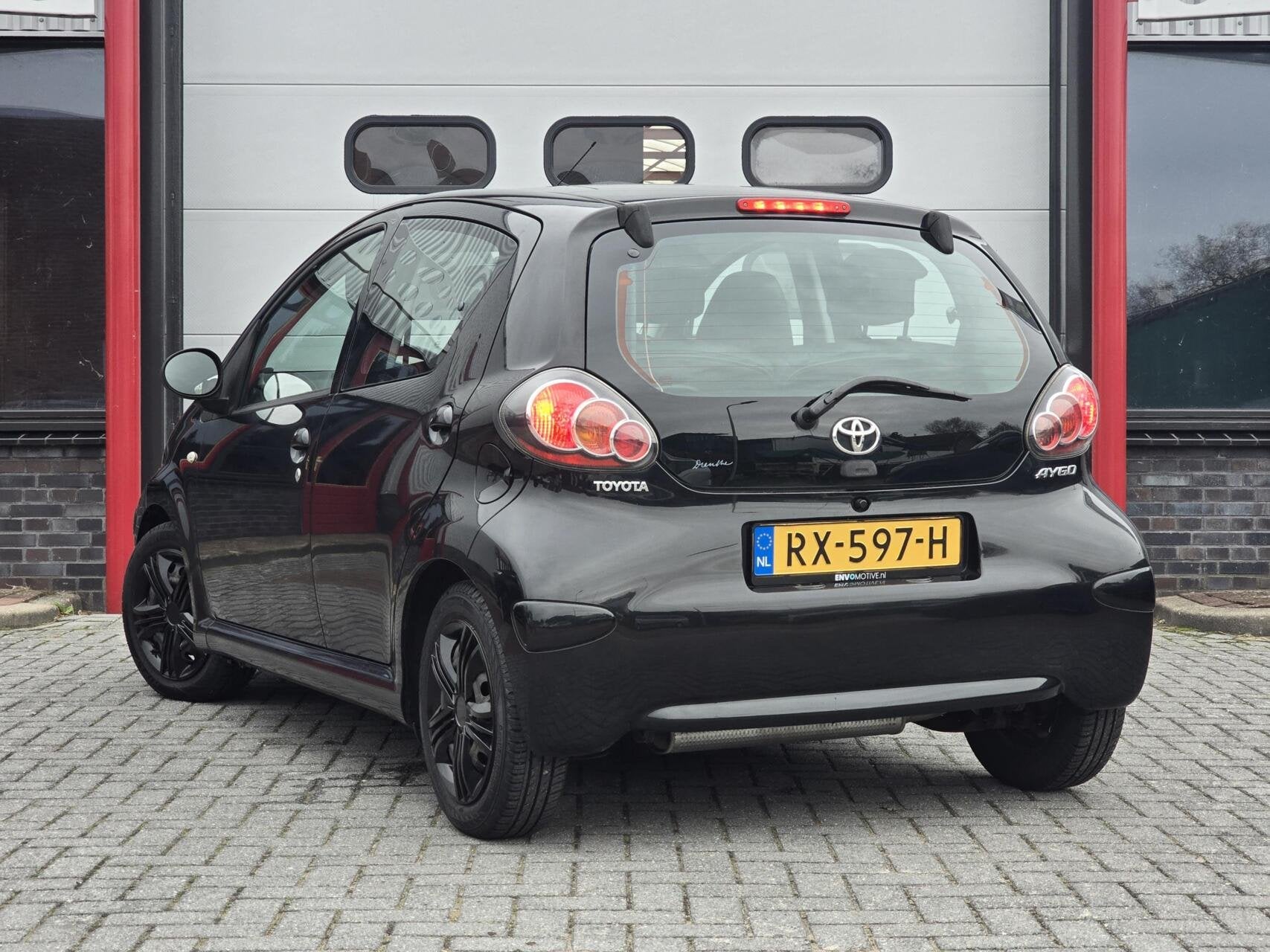 Toyota Aygo 1.0-12V Comfort Airco/Centr. Vergr/Half leer, Auto's, Voorwielaandrijving, Gebruikt, Zwart, 4 stoelen