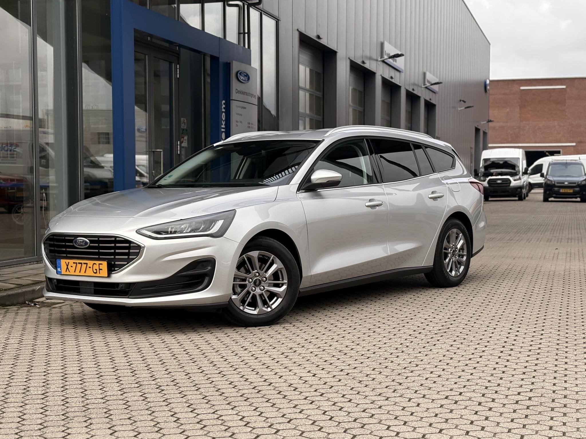 Ford Focus Wagon 1.0 EcoBoost Hybrid Titanium I WINTER PACK, Auto's, Gebruikt, Origineel Nederlands, 19 km/l, Zilver of Grijs