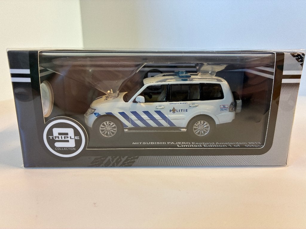 27611: Mitsubishi Pajero - Eenheid Amsterdam - 2013 - 1:43, Hobby en Vrije tijd, Auto, Nieuw, Ophalen of Verzenden, Bachsatztstr. 54 D 72131 Ofterdingen, Germany