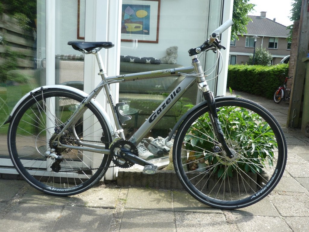 Gazelle puerto hydrid 57 cm met voorvering en schijven., 28 inch, Gebruikt, Vering, 57 tot 61 cm