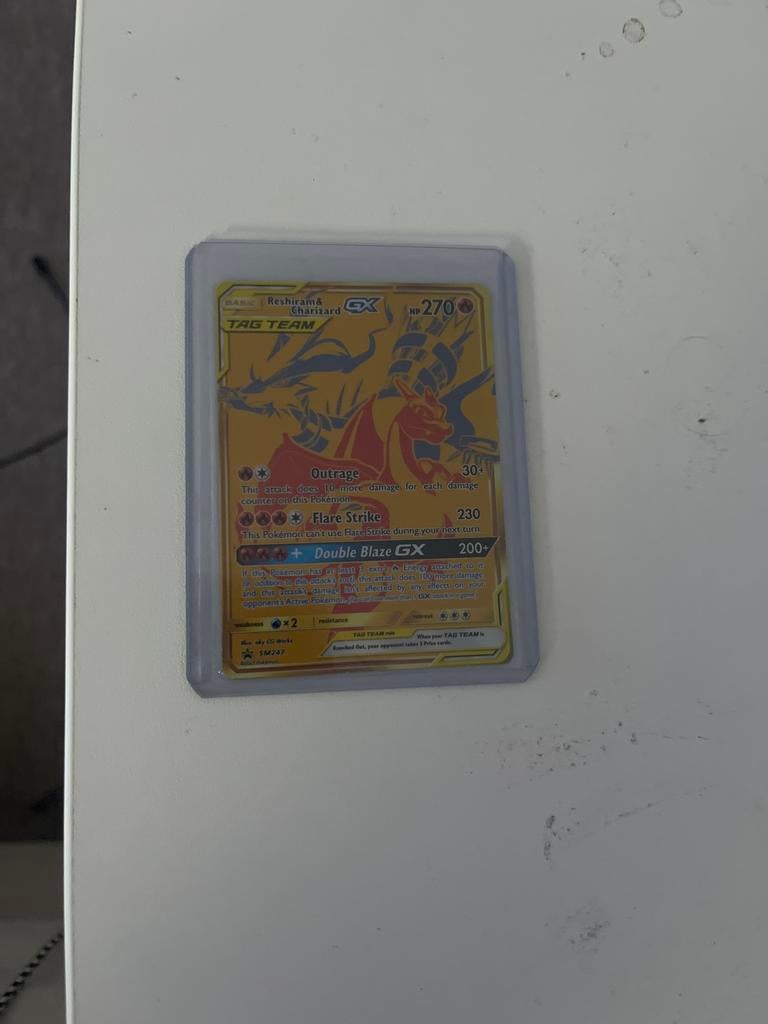 Reshiram & Charizard GX Gold Tag Team Pokémon Kaart, Ophalen of Verzenden, Zo goed als nieuw, Losse kaart, Foil
