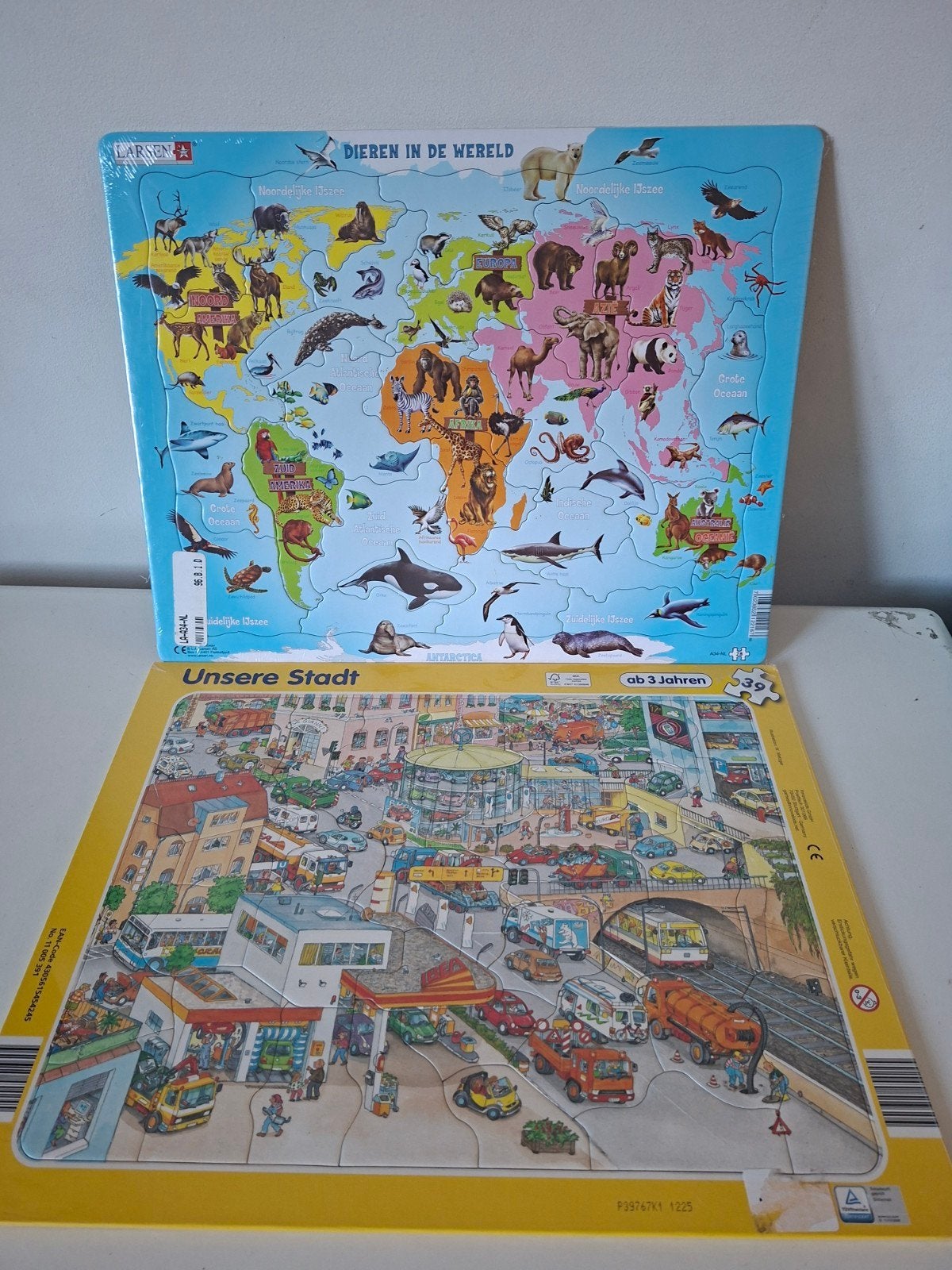 Larsen puzzel Dieren in de Wereld en puzzel Onze stad, Ophalen of Verzenden, 10 tot 50 stukjes, Nieuw, 2 tot 4 jaar