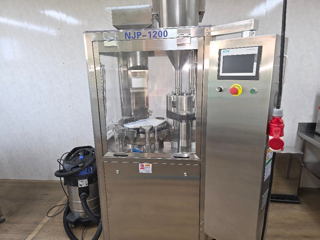 NJP1200 automatische capsuleermachine, Ophalen