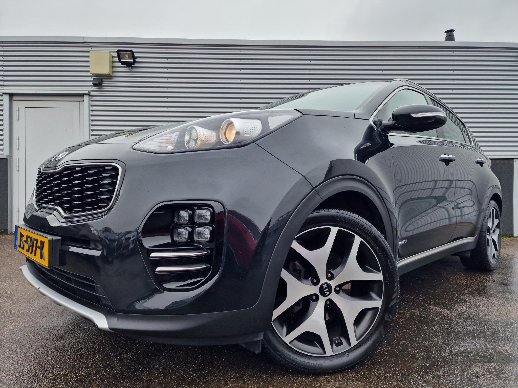 Kia Sportage 1.6 T-GDI 4WD GT-Line First Edition Nieuw gelev, Auto's, Parkeersensor, Gebruikt, 4 cilinders, Zwart