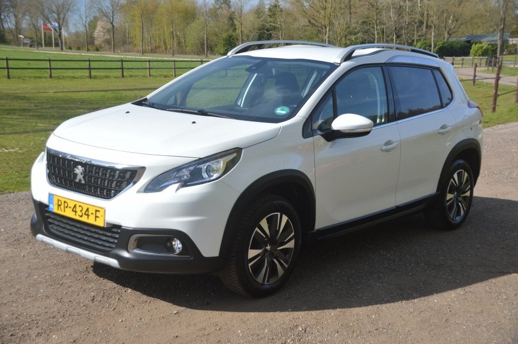 Peugeot 2008 1.2 PureTech Allure Clima Cruise PDC Navi, Voorwielaandrijving, Euro 6, Leder en Stof, Origineel Nederlands