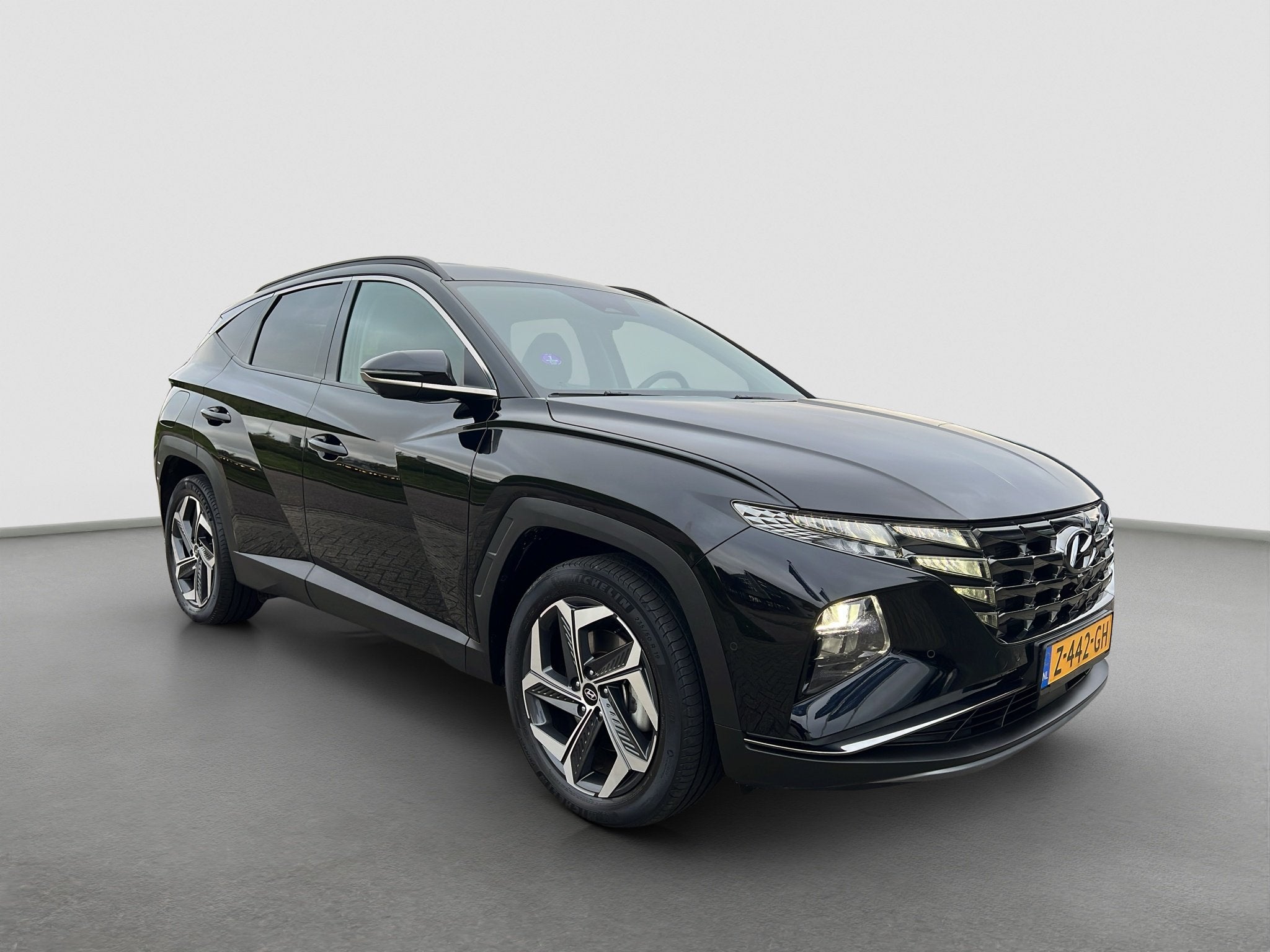 Hyundai Tucson 1.6 T-GDI 265pk PHEV Premium 4WD, Auto's, Hyundai, Gebruikt, 4 cilinders, Zwart, Bedrijf