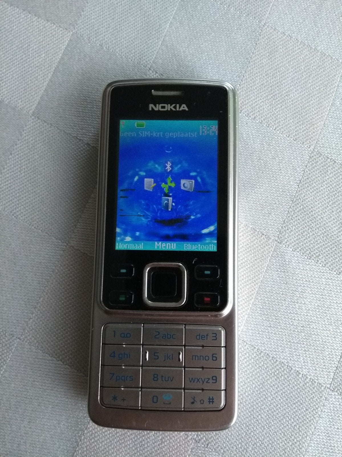 Nokia 6300 mobiele telefoon met camera en rvs achterzijde, Gebruikt, Fysiek toetsenbord, Ophalen of Verzenden, Minder dan 3 megapixel