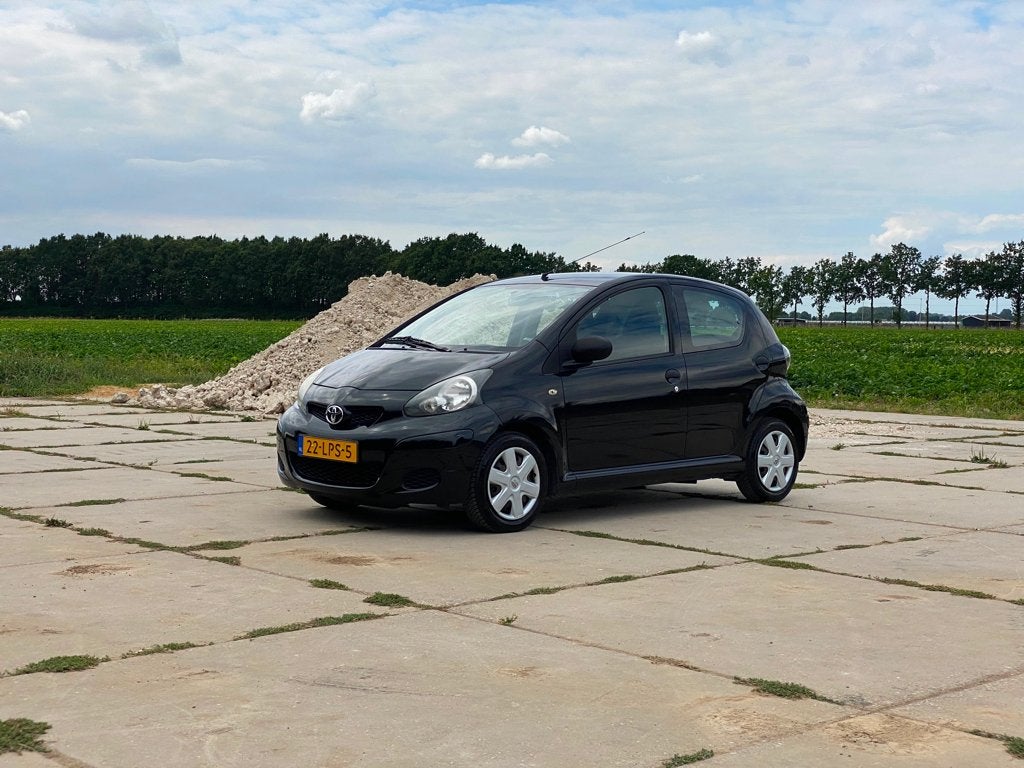 Toyota Aygo 1.0 12V Vvt-i 5DRS 2010 Zwart, Auto's, Toyota, Voorwielaandrijving, Stof, 4 stoelen, Bedrijf