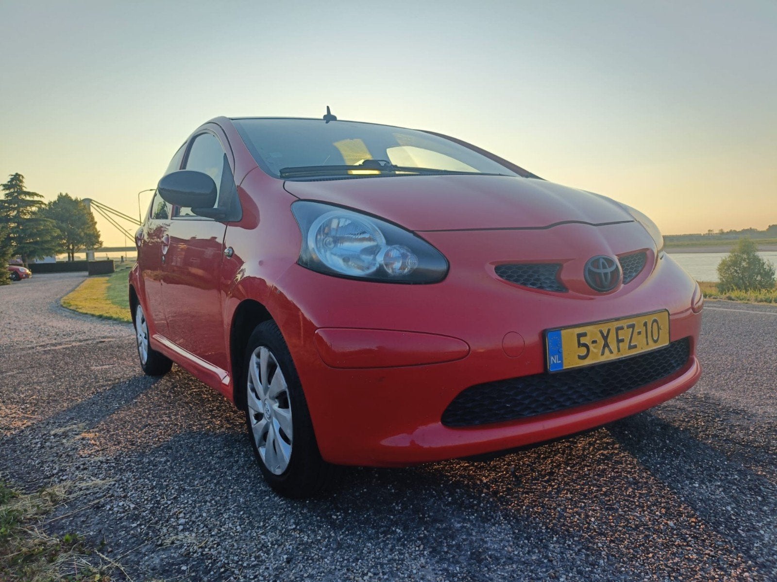 Toyota Aygo 1.0 12V 5DRS 2006, Auto's, Toyota, Aygo, Benzine, A, Hatchback, Handgeschakeld, Geïmporteerd, Rood, Voorwielaandrijving