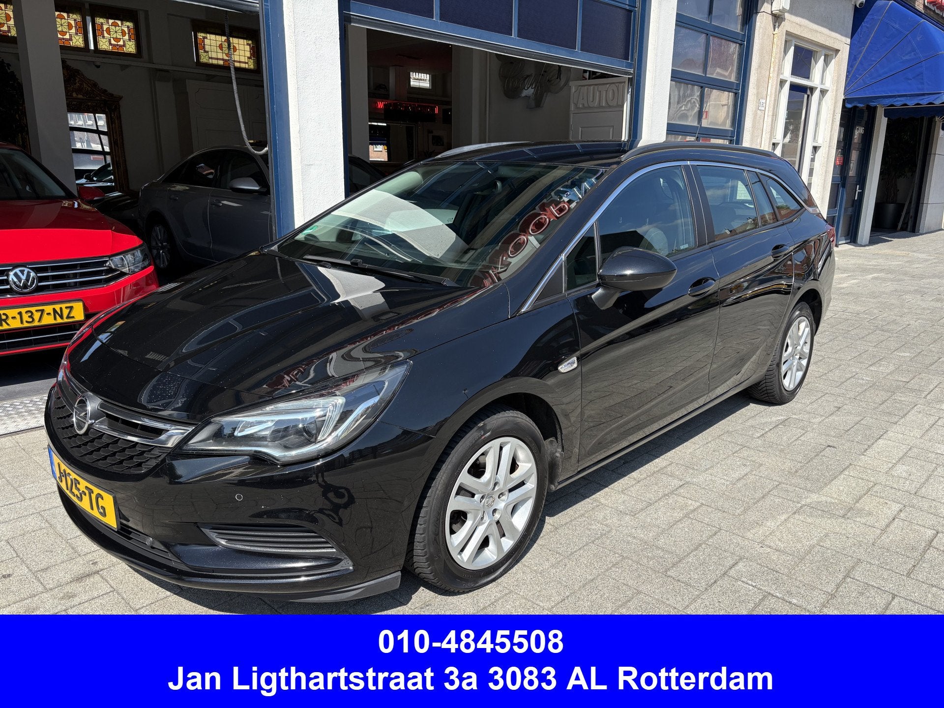 Opel Astra Sports Tourer 1.4 Business Executive AUTOMAAT/AIR, Auto's, Gebruikt, 150 pk, Zwart, 1240 kg