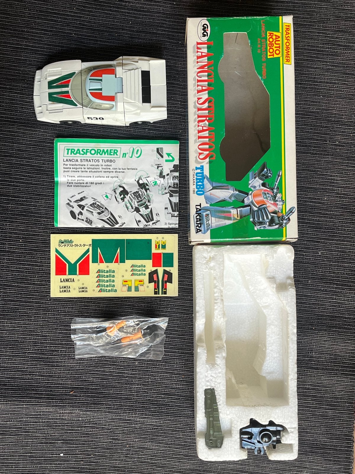 Gig Lancia Stratos Wheeljack Transformers Trasformer, G1, Ophalen of Verzenden, Zo goed als nieuw, Autobots