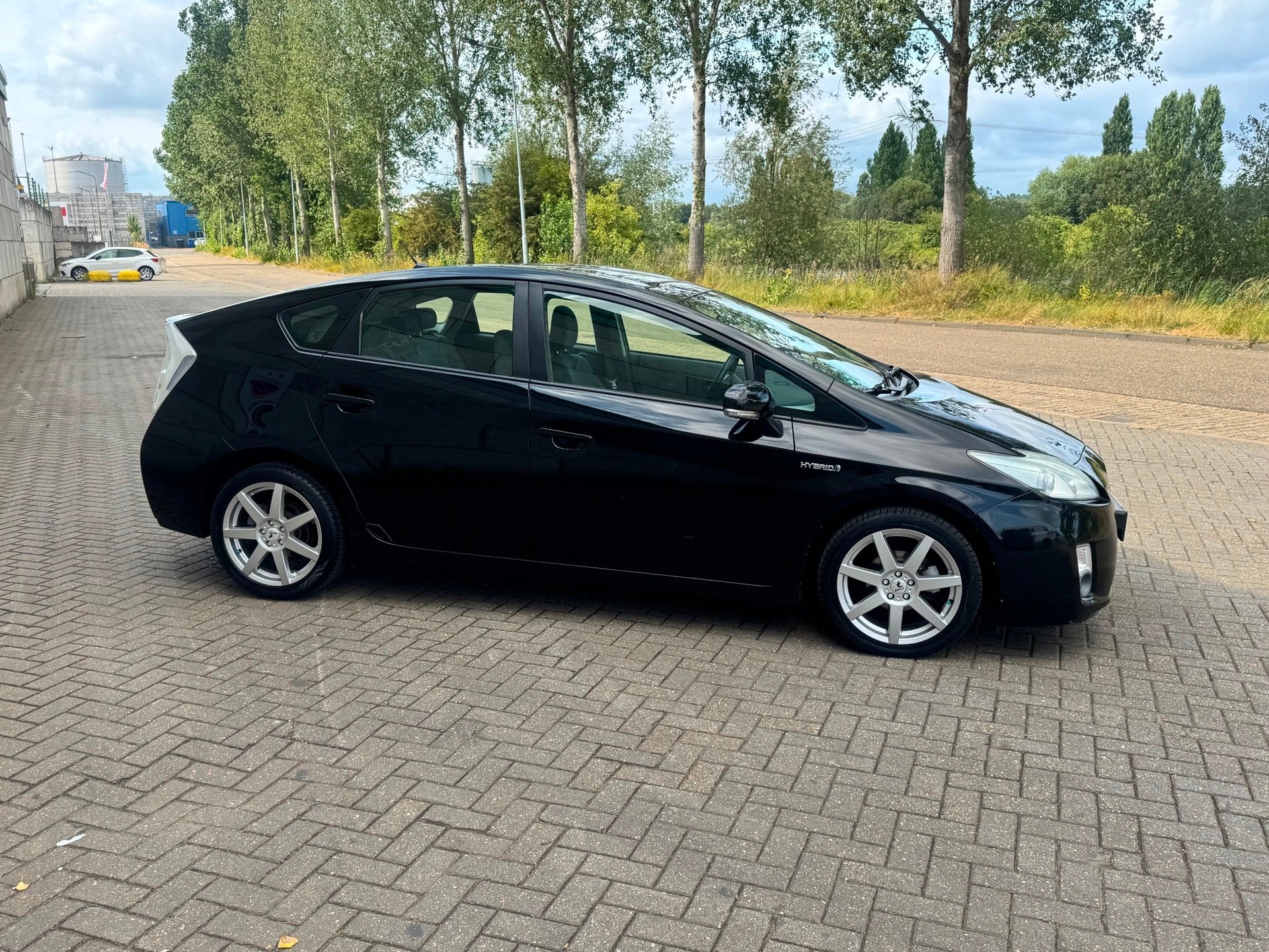 Toyota Prius 1.8 Aspiration, Auto's, Stof, Gebruikt, 4 cilinders, Zwart
