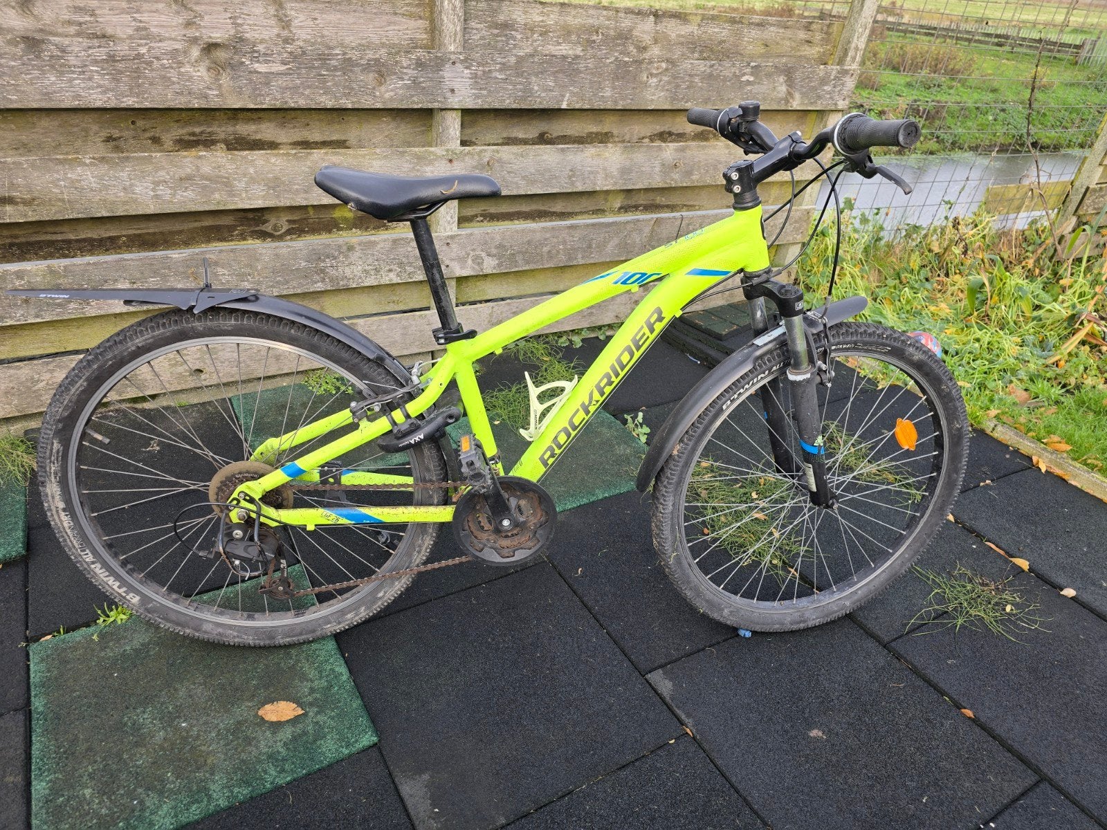 Rockrider ST100 Sport Trail MTB Neon Geel 8-12 jr, Ophalen, Gebruikt, Velgrem, Overige merken