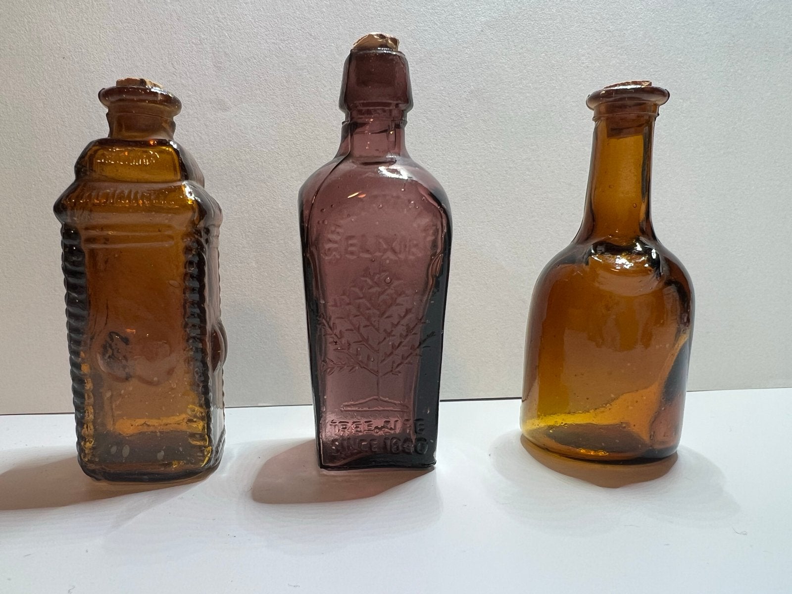 Set van 3 antieke apothekersflessen - bruin en paars glas, Ophalen of Verzenden