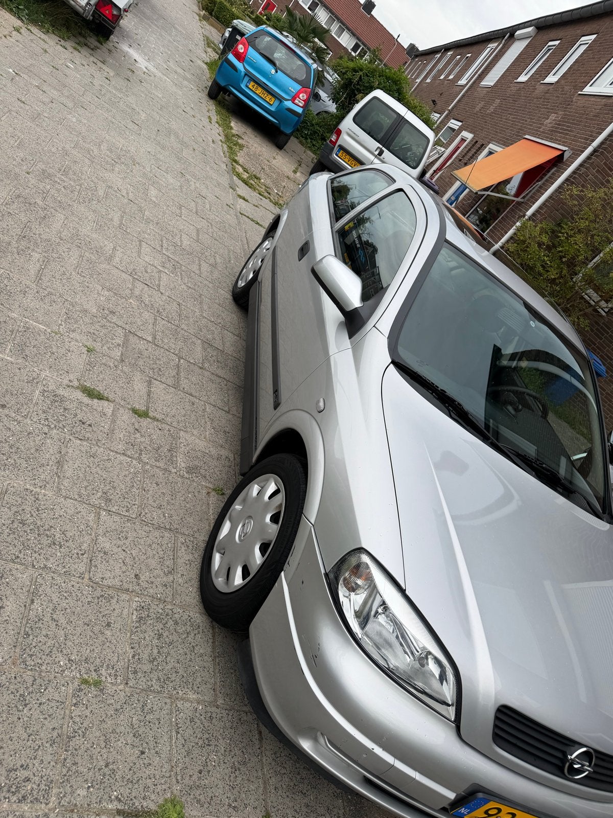 Opel Astra 1.6 I AUT 1999 Grijs, Auto's, Zwart, 4 cilinders, 49 €/maand, Origineel Nederlands