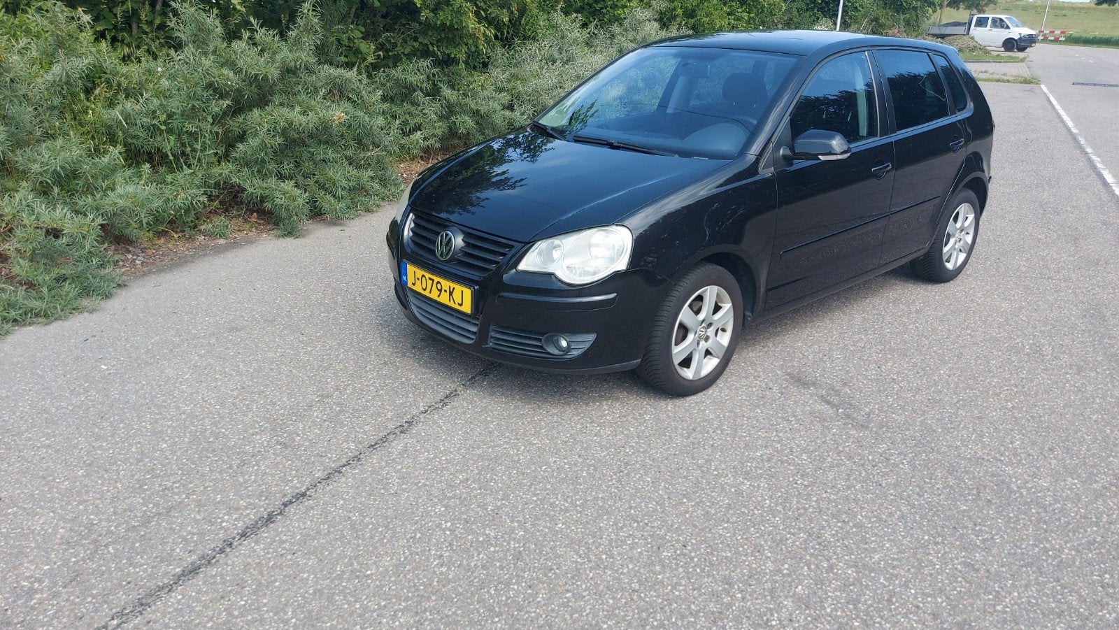 Volkswagen Polo 1.4 16V 59KW 2009 Zwart, Auto's, Volkswagen, Voorwielaandrijving, 40 €/maand, Zwart, 4 cilinders