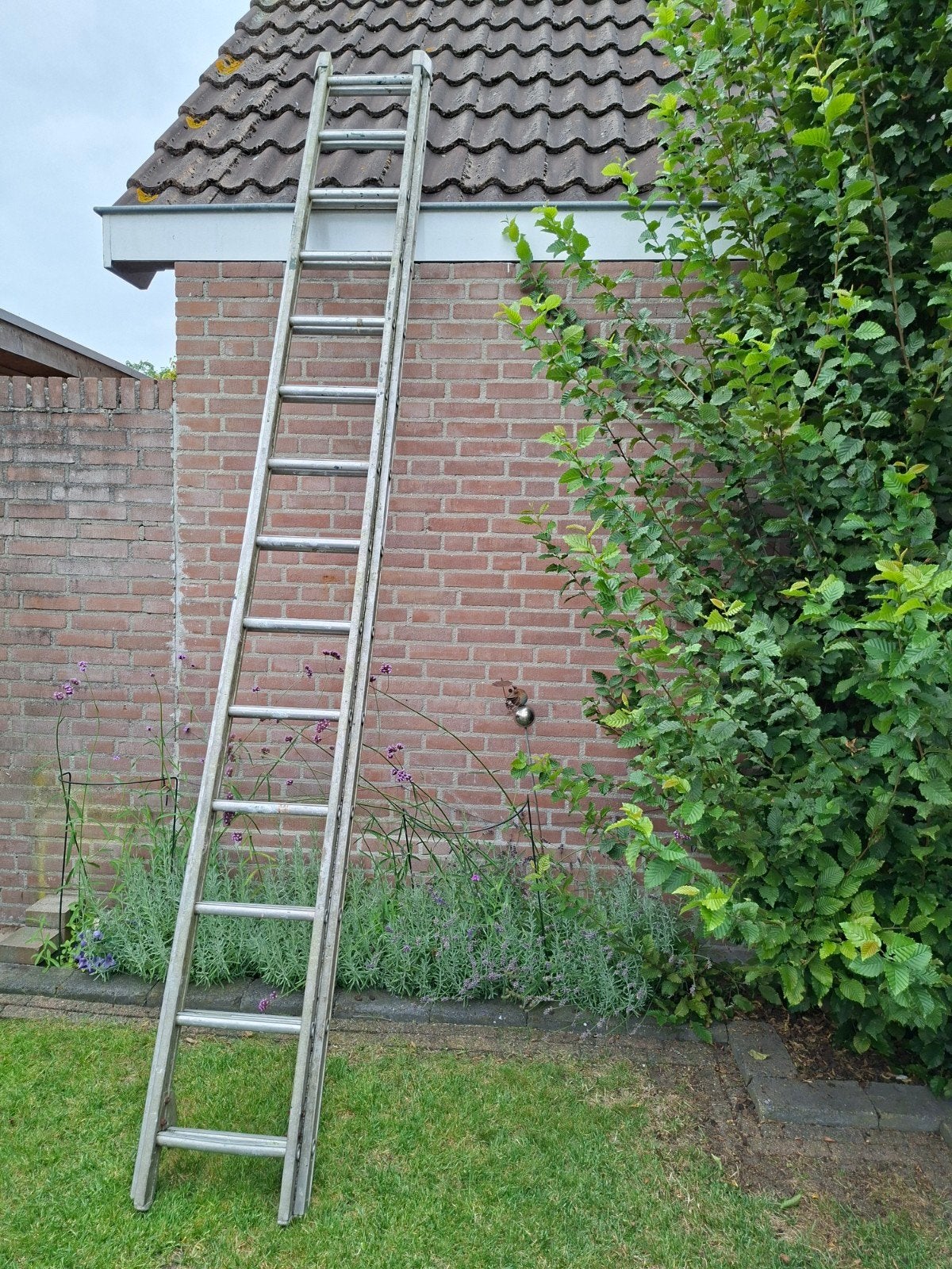 Aluminium uitschuifbare ladder  tot 7 meter Gebruikt., Ophalen of Verzenden