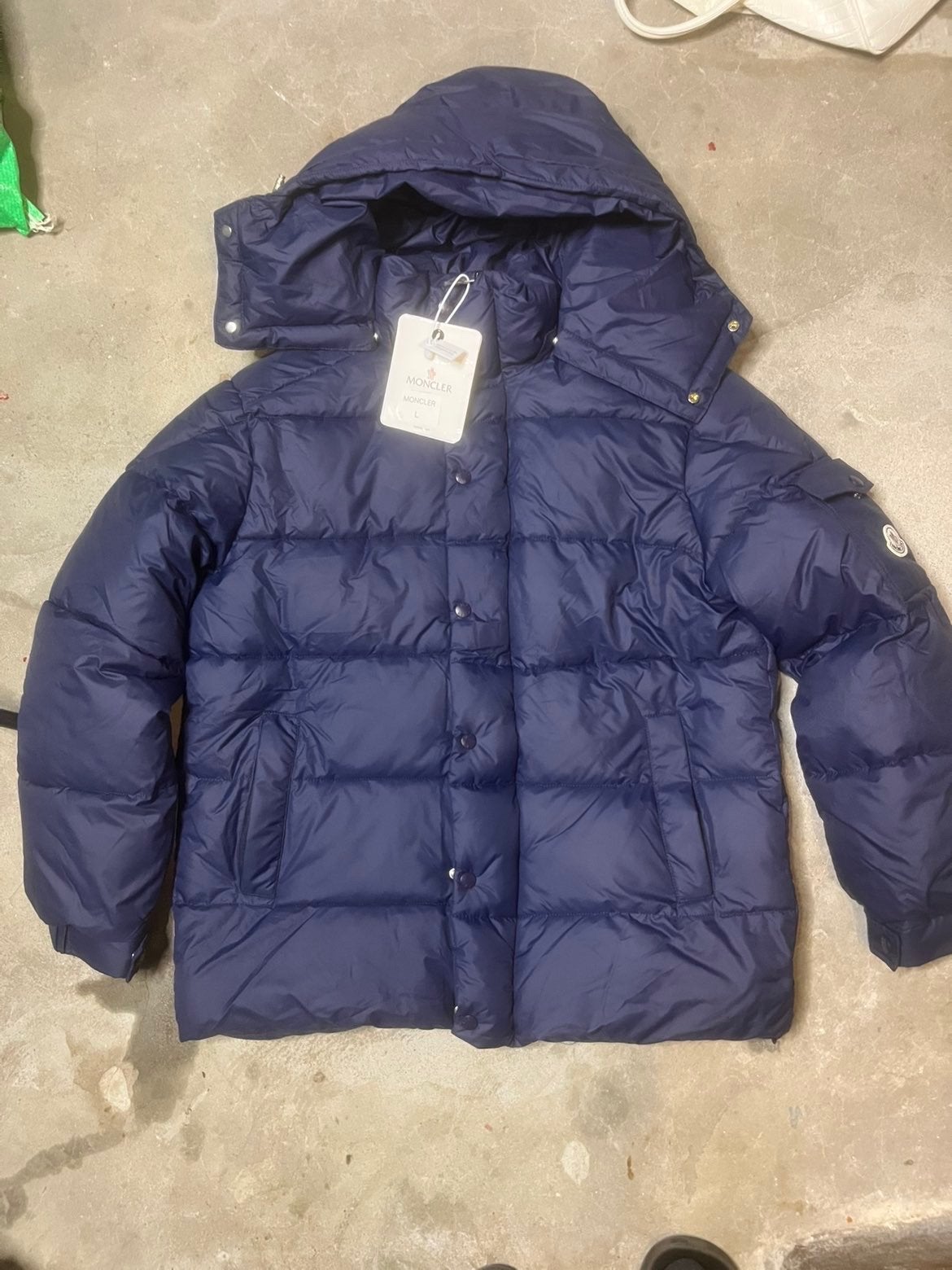 Moncler donsjack heren - Maat L - Nieuw met kaartjes, Ophalen of Verzenden, Nieuw, Maat 52/54 (L), Blauw