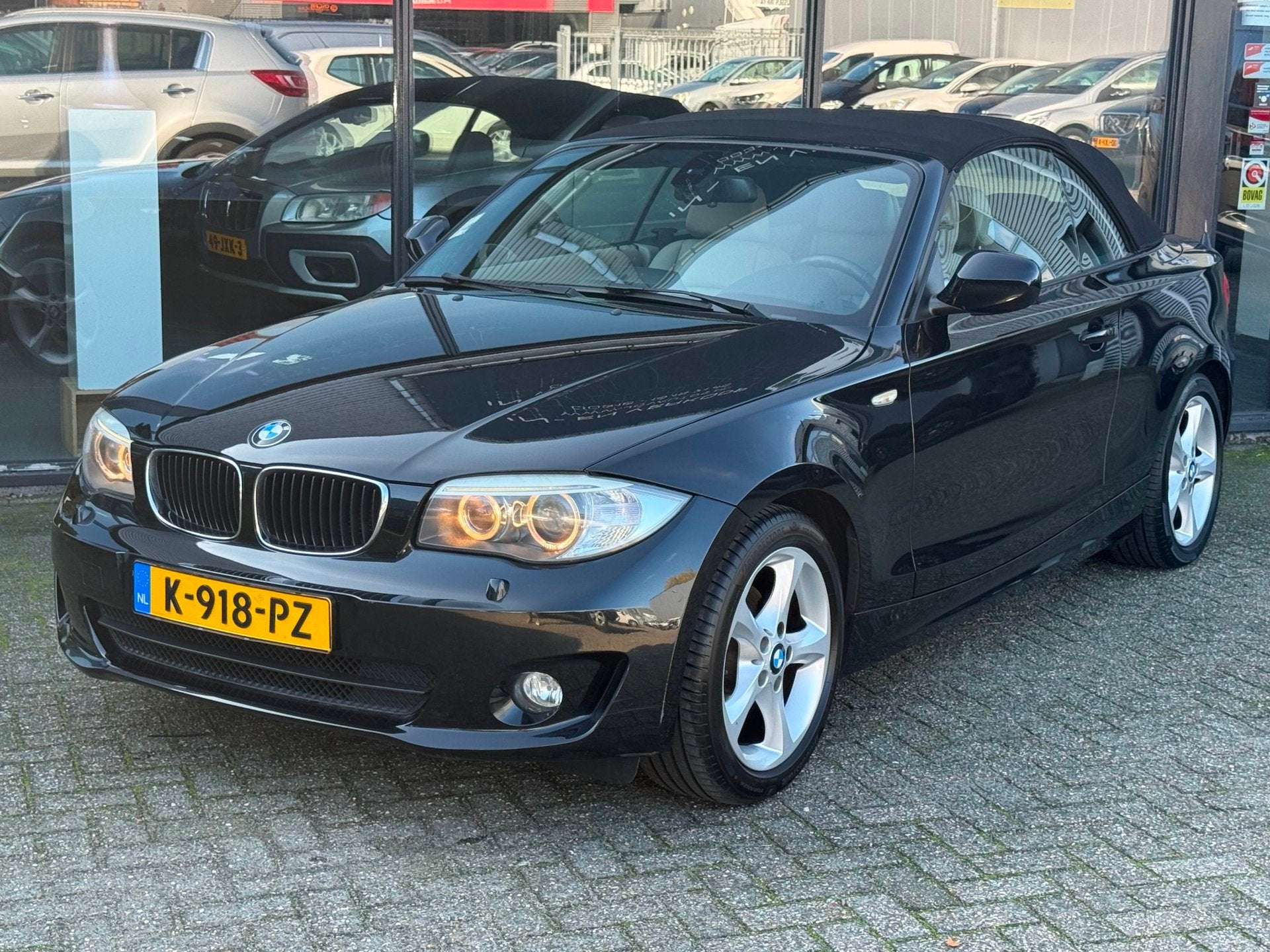 BMW 1-serie Cabrio 118i High Executive LEER/NAVI/STOELVERWAR, Auto's, Euro 5, Cabriolet, 4 stoelen, Zwart