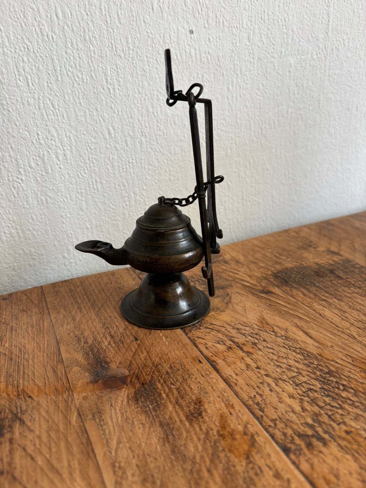 Antieke olie brander, Ophalen