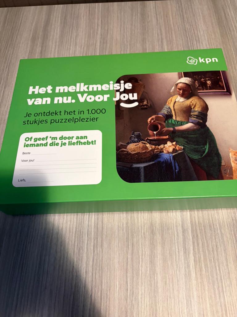 KPN Het Melkmeisje van nu 1000 stukjes puzzel, Hobby en Vrije tijd, Ophalen of Verzenden, 500 t/m 1500 stukjes, Nieuw, Legpuzzel