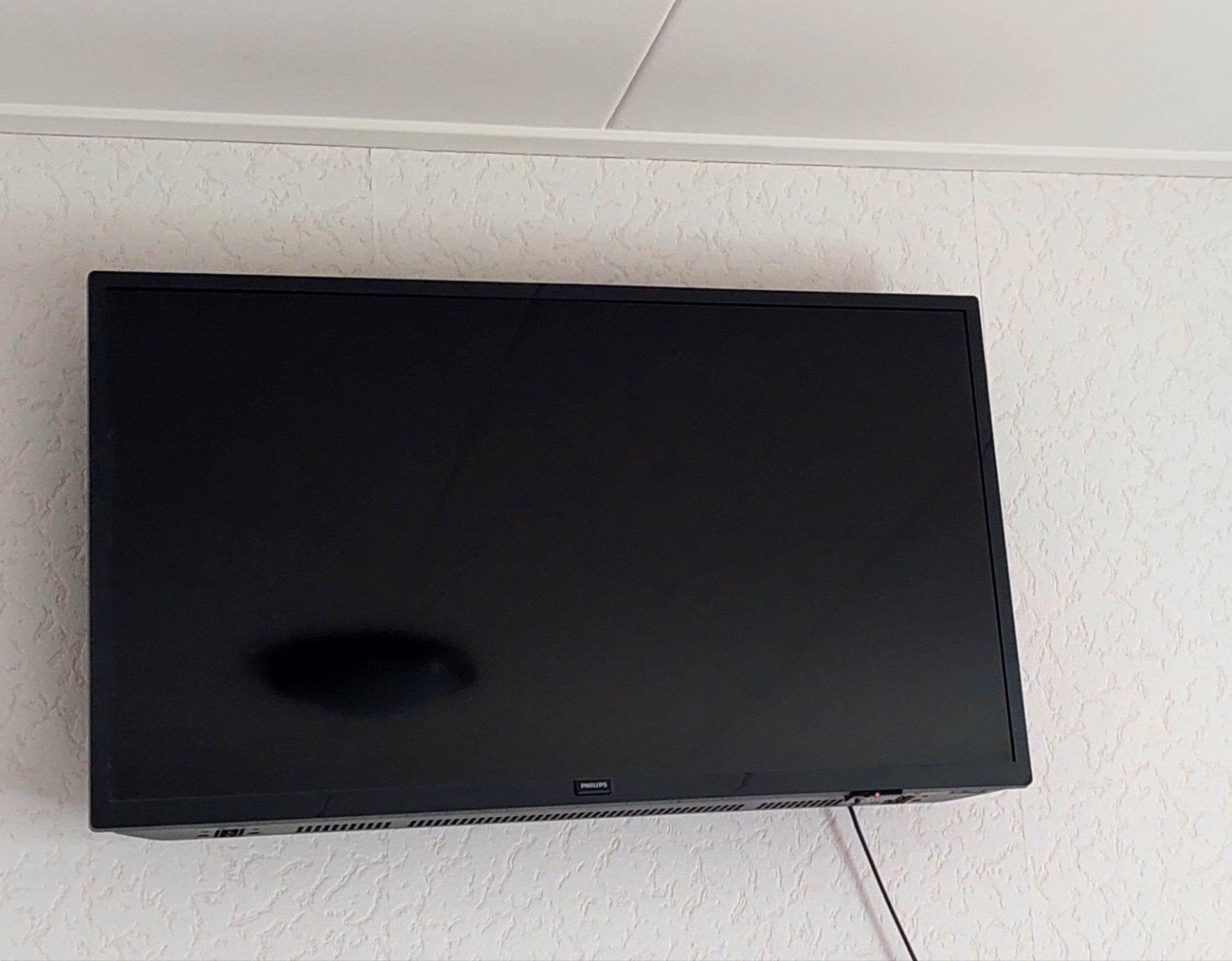 Philips TV met Hama muurbeugel, Ophalen