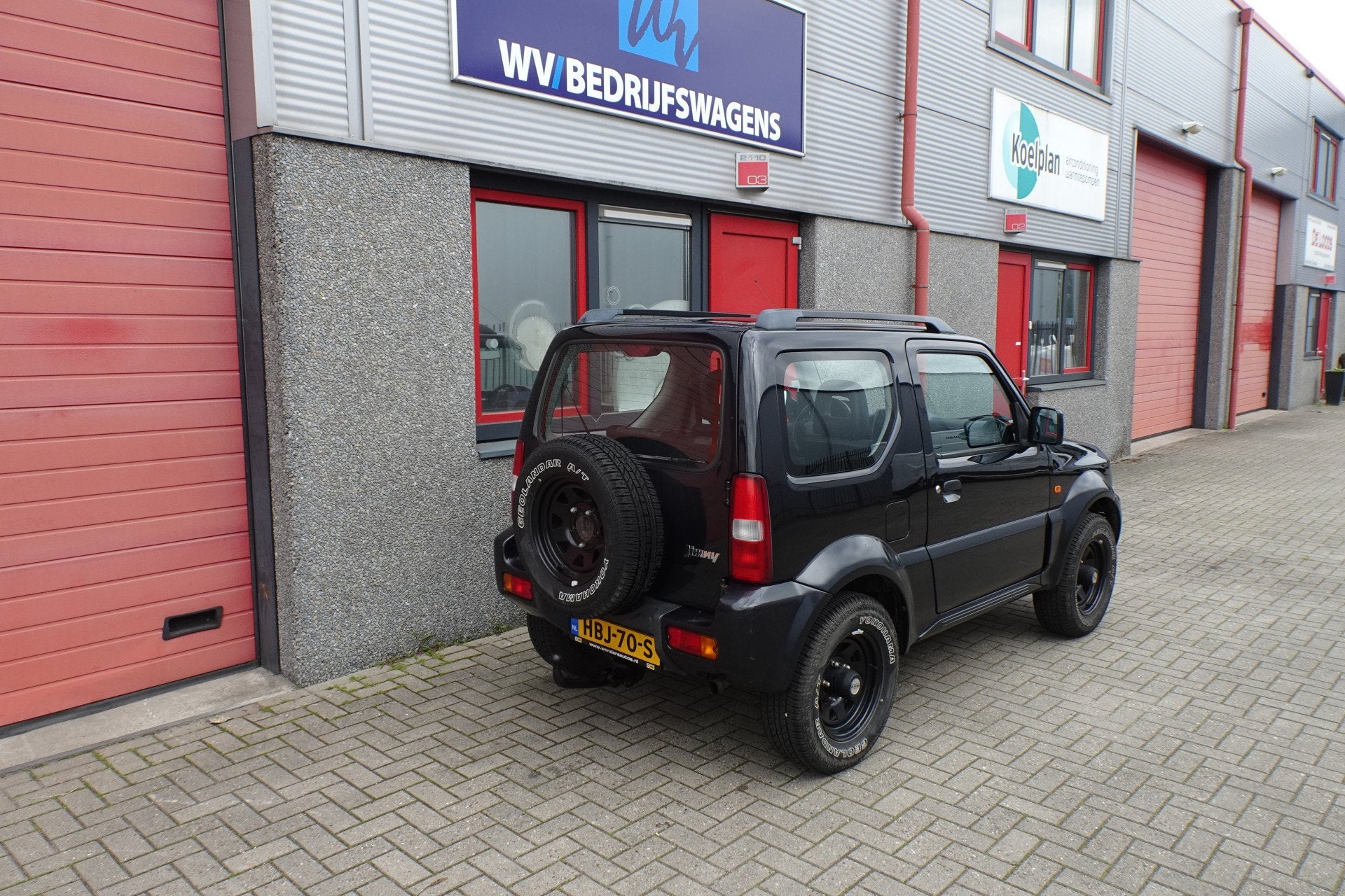 Suzuki Jimny 1.3 JX 4 x 4 127009 km (bj 2009), Auto's, Gebruikt, Zwart, 4 stoelen, Zwart