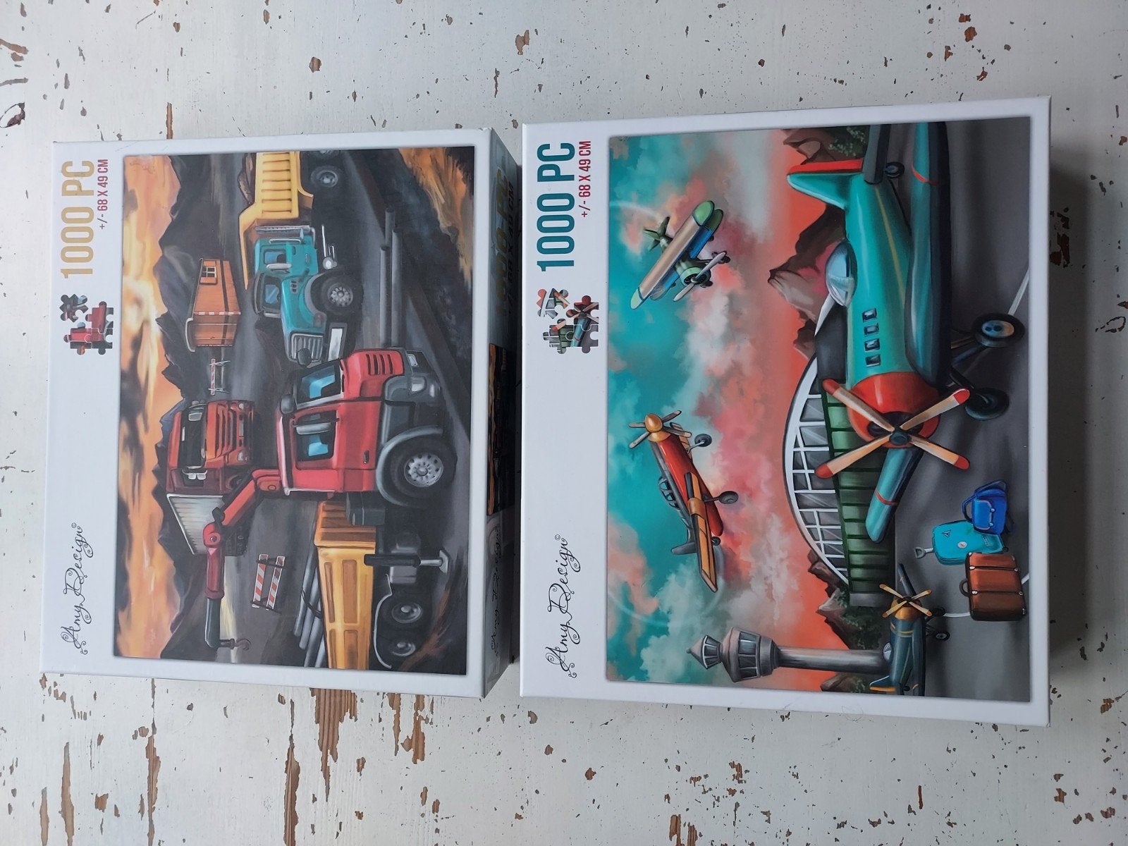 2 Amy Design puzzels 1000 stukjes: Vliegtuig & Vrachtwagen, Ophalen of Verzenden, Zo goed als nieuw