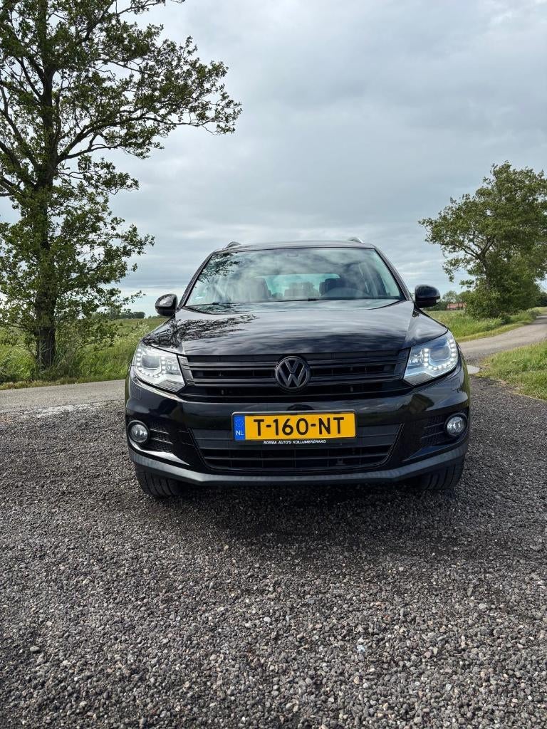 VW Tiguan 1.4 TSI 90KW BMT 2011 Zwart, Auto's, Voorwielaandrijving, Zwart, 4 cilinders, 75 €/maand