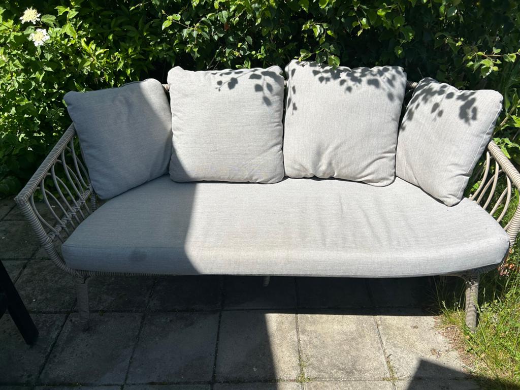 Grijze Kunststof Rotan tuinbank met extra  kussens, Ophalen, Gebruikt, Rotan
