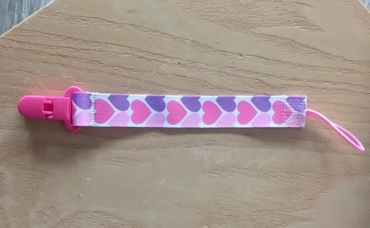 Speenkoord nieuw roze dubbelzijdig bedrukt, Ophalen of Verzenden, Nieuw