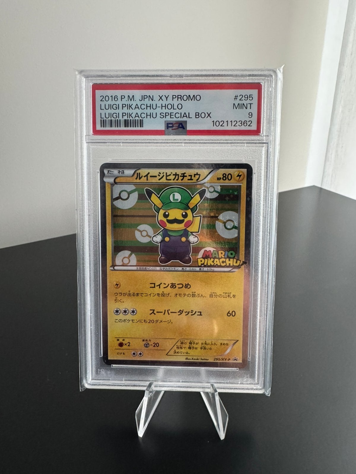 LUIGI PIKACHU PONCHO HALF ART - PSA 9, Ophalen of Verzenden, Zo goed als nieuw