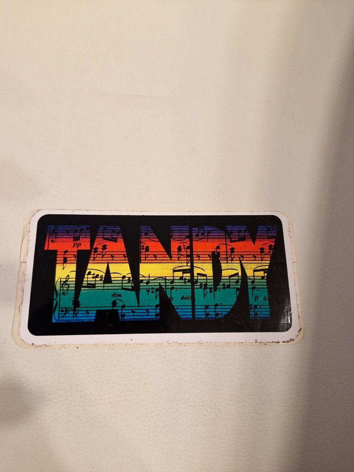 G 021 Tandy sticker 18 x 9 cm - Muzieknoten regenboog, Ophalen of Verzenden, Zo goed als nieuw, Overige typen