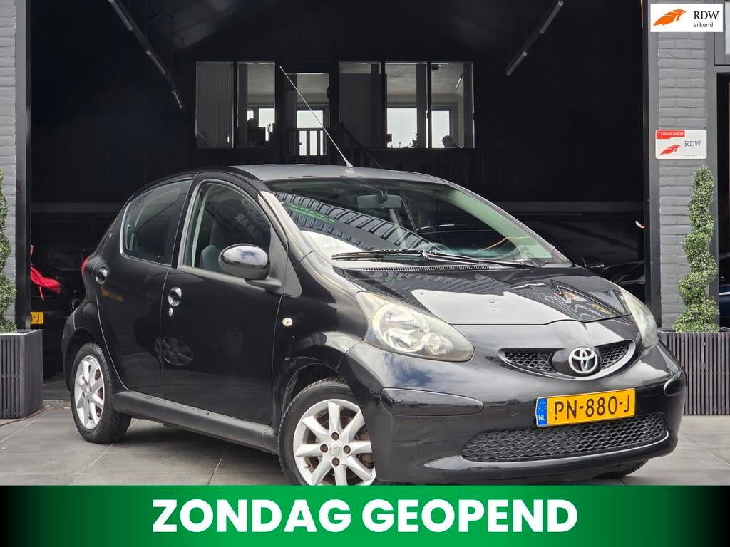 Toyota Aygo 1.0-12V|Airco|Elek.Ramen|Navi|Trekhaak|AUX, Auto's, Toyota, Voorwielaandrijving, Stof, Gebruikt, 4 stoelen