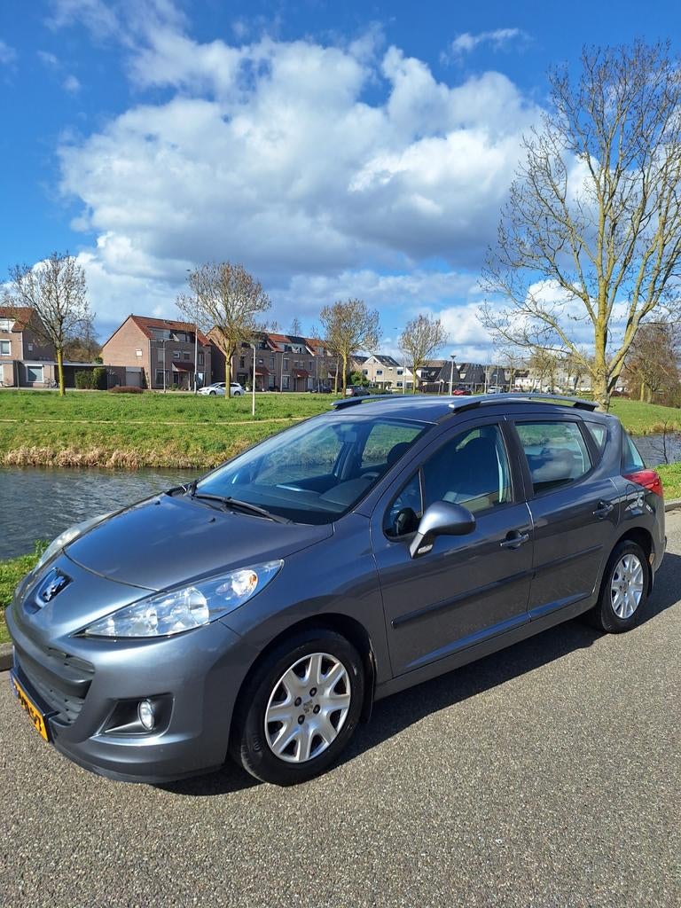 Peugeot 207 1.4 95pk 2010 Grijs, Auto's, Peugeot, Voorwielaandrijving, Stof, Zwart, Origineel Nederlands