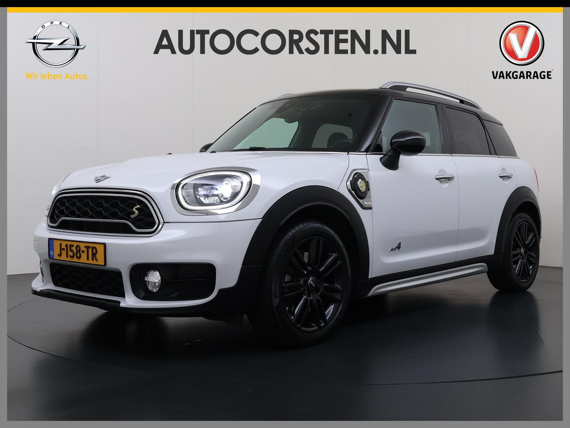 MINI Countryman 224PK Hybrid Automaat Cooper S E ALL4 Chili, Auto's, Verwarmde buitenspiegels, Gebruikt, Leder en Stof, Wit