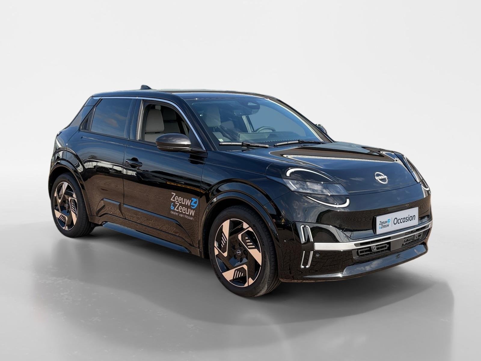 Nissan Micra EVOLVE 52 kWh *Navi+Camera*Winter Pack*Harman K, Stof, 150 pk, Zwart, Origineel Nederlands