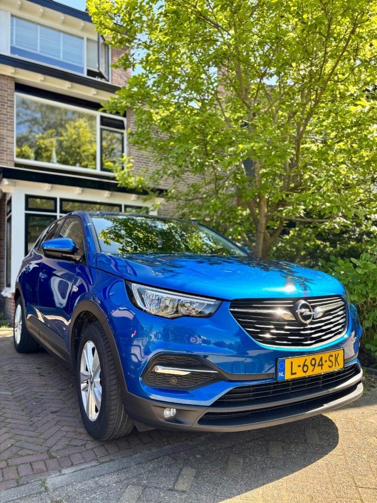 Opel Grandland X 1.2 Turbo 130pk S&S Aut 2019 Blauw, Auto's, Stof, Blauw, 14 km/l, Grijs