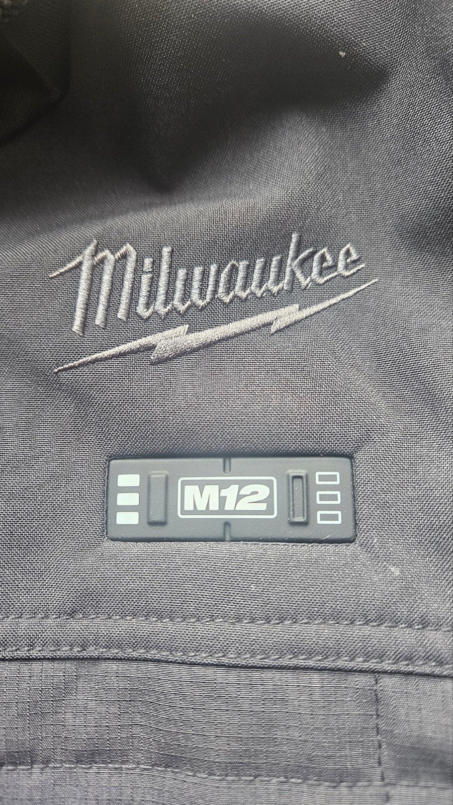 milwaukee m12 verwarmde jas, Maat 52/54 (L), Zwart, Ophalen of Verzenden, Zo goed als nieuw