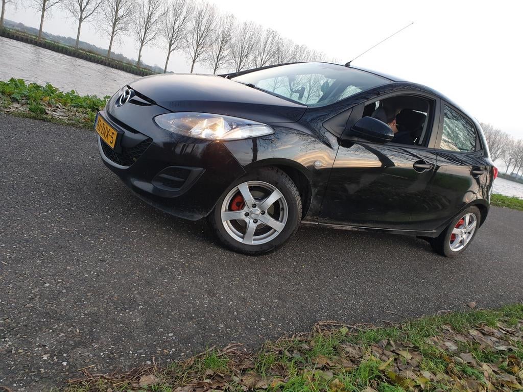 Mazda 2 1.3 Bifuel 75pk 5D 2013 Zwart, Auto's, Mazda, Voorwielaandrijving, Euro 5, 74 pk, Zwart
