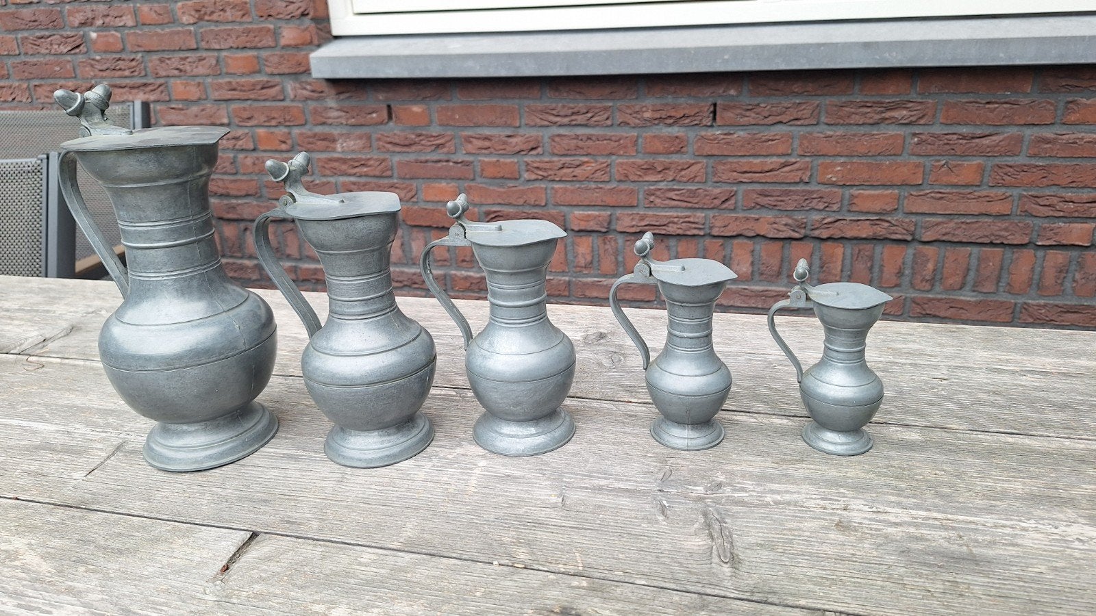 Set van 5 antieke tinnen kannen met engel en Tiel logo, Antiek en Kunst, Ophalen of Verzenden