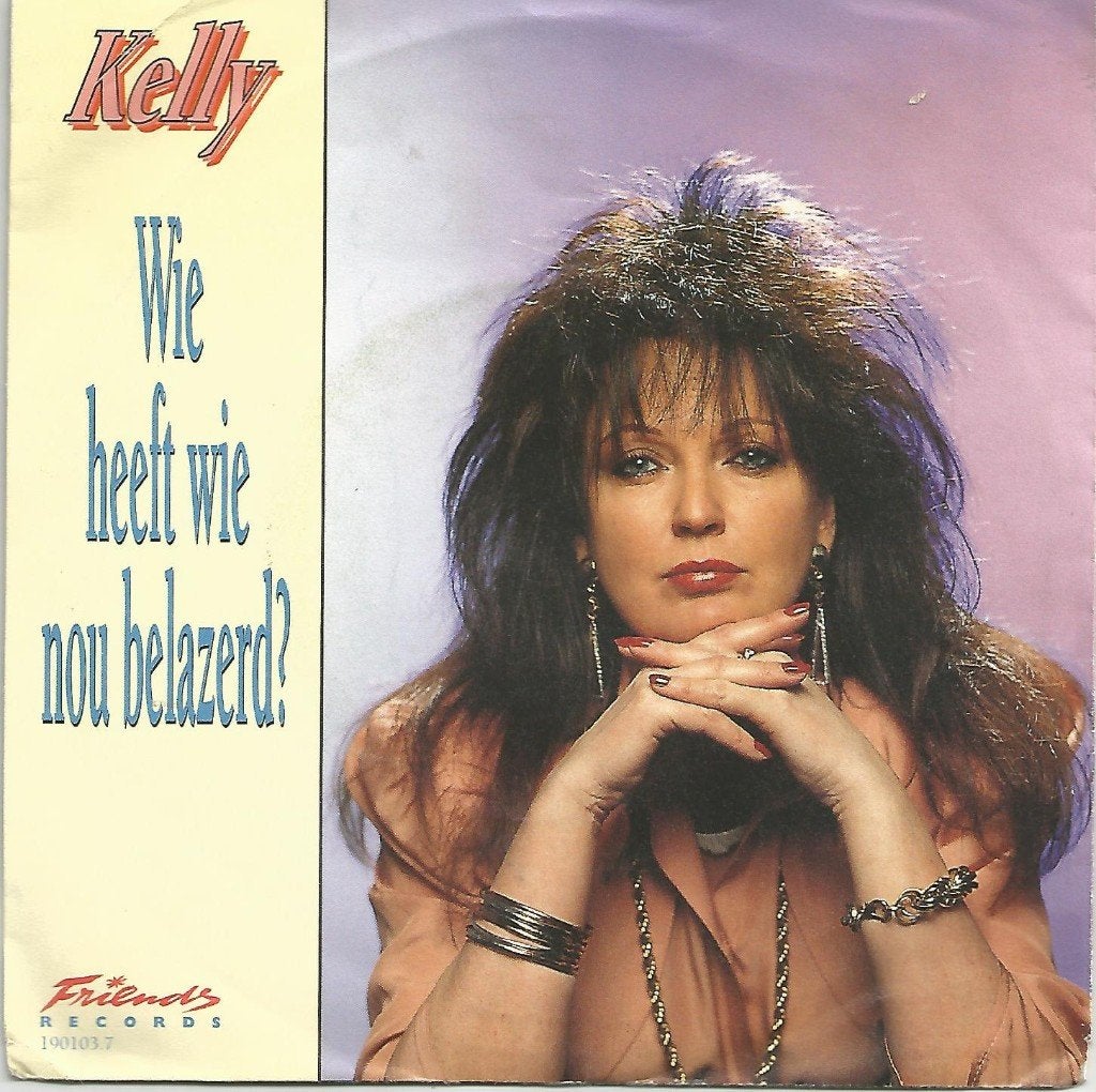 Kelly – Wie Heeft Wie Nu Belazerd? (1992), Fotohoes, 7 inch, Ophalen of Verzenden, Zo goed als nieuw