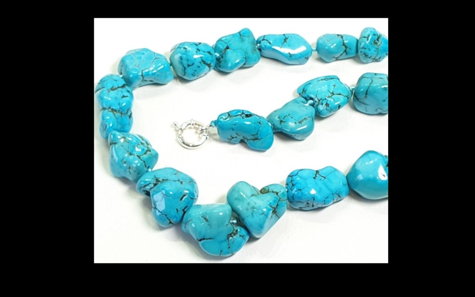 Foto 2 van Prachtig handgesponnen ketting met Turquoise.