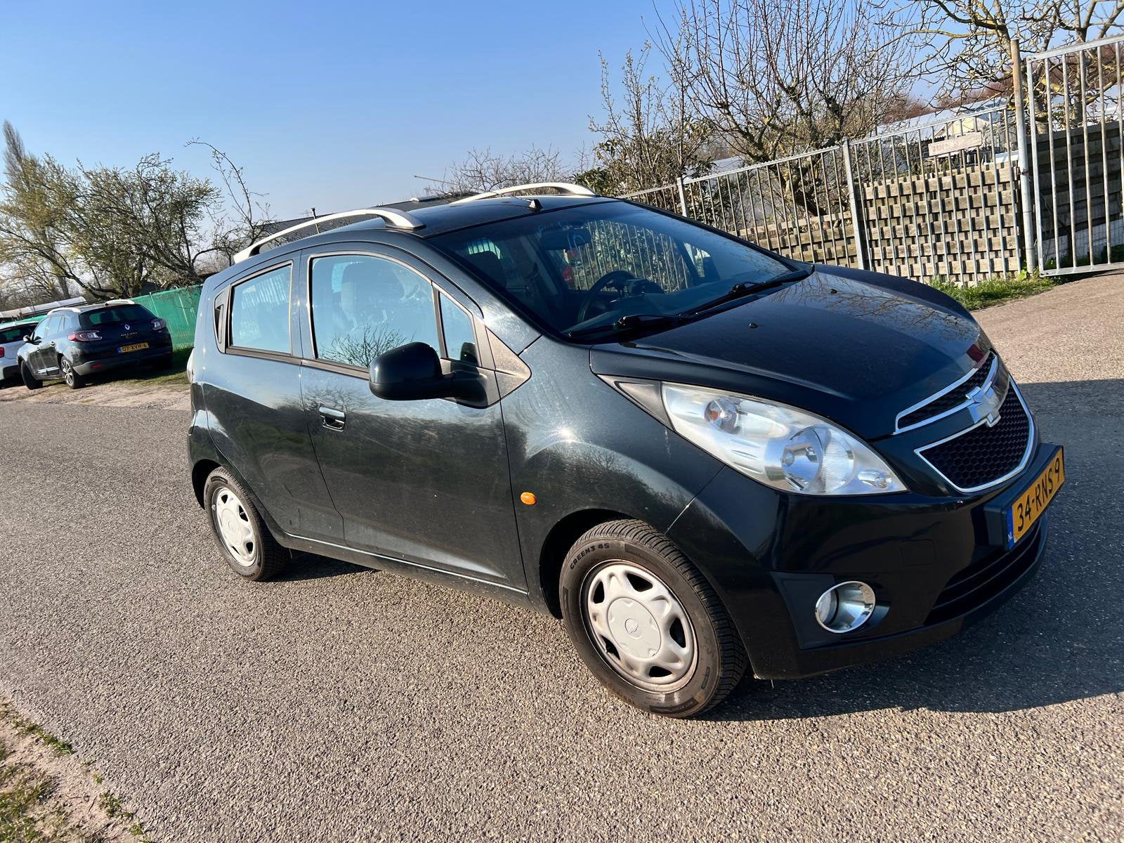 Chevrolet Spark 1.0 Bifuel 2011 Zwart, Auto's, 65 pk, 37 €/maand, 4 cilinders, 0 kg
