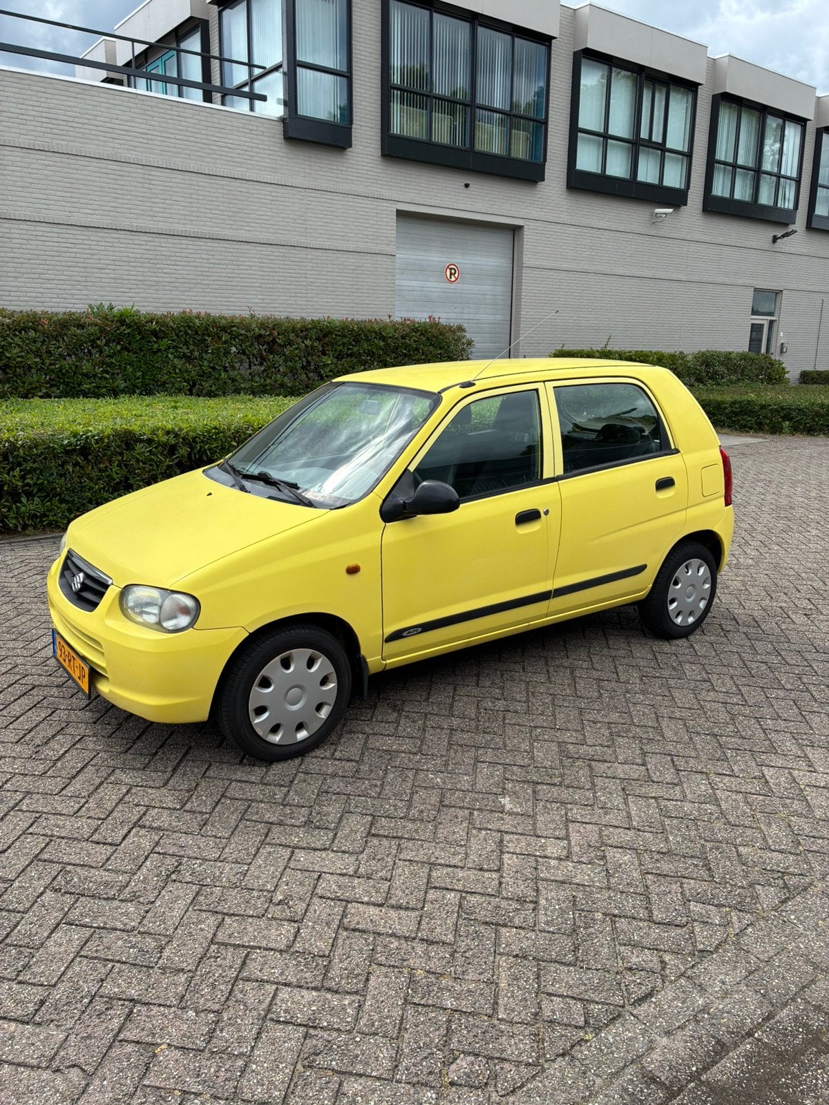 Suzuki Alto 1.1 AUT 2005 Geel 1e EIG 52DKM NAP APK, Stof, 4 stoelen, Elektrische ramen, Grijs