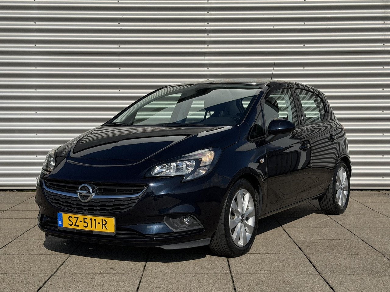 Opel Corsa 1.4 Favourite | Airco | Cruise Control | Navigati, Auto's, Gebruikt, 1398 cc, 4 cilinders, 49 €/maand