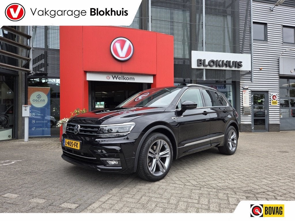 Volkswagen Tiguan 1.5 TSI Highl. Bus R (bj 2020, automaat), Auto's, Volkswagen, 12 maanden, Euro 6, 4 cilinders, Zwart